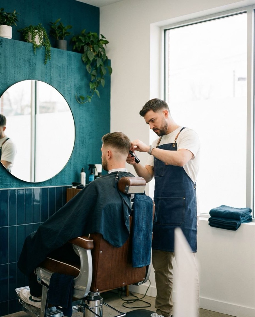 A barber giving a client a haircut